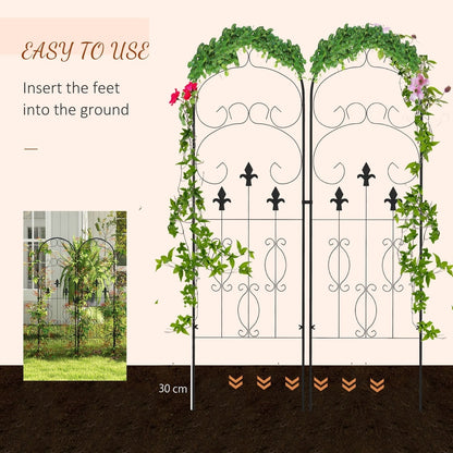 Metal garden trellis being inserted into the ground for support