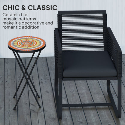 The garden table standing next to a modern black outdoor chair on a wooden deck
