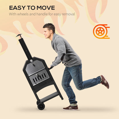 A man tilting the charcoal grill to move it using the side handle and wheels