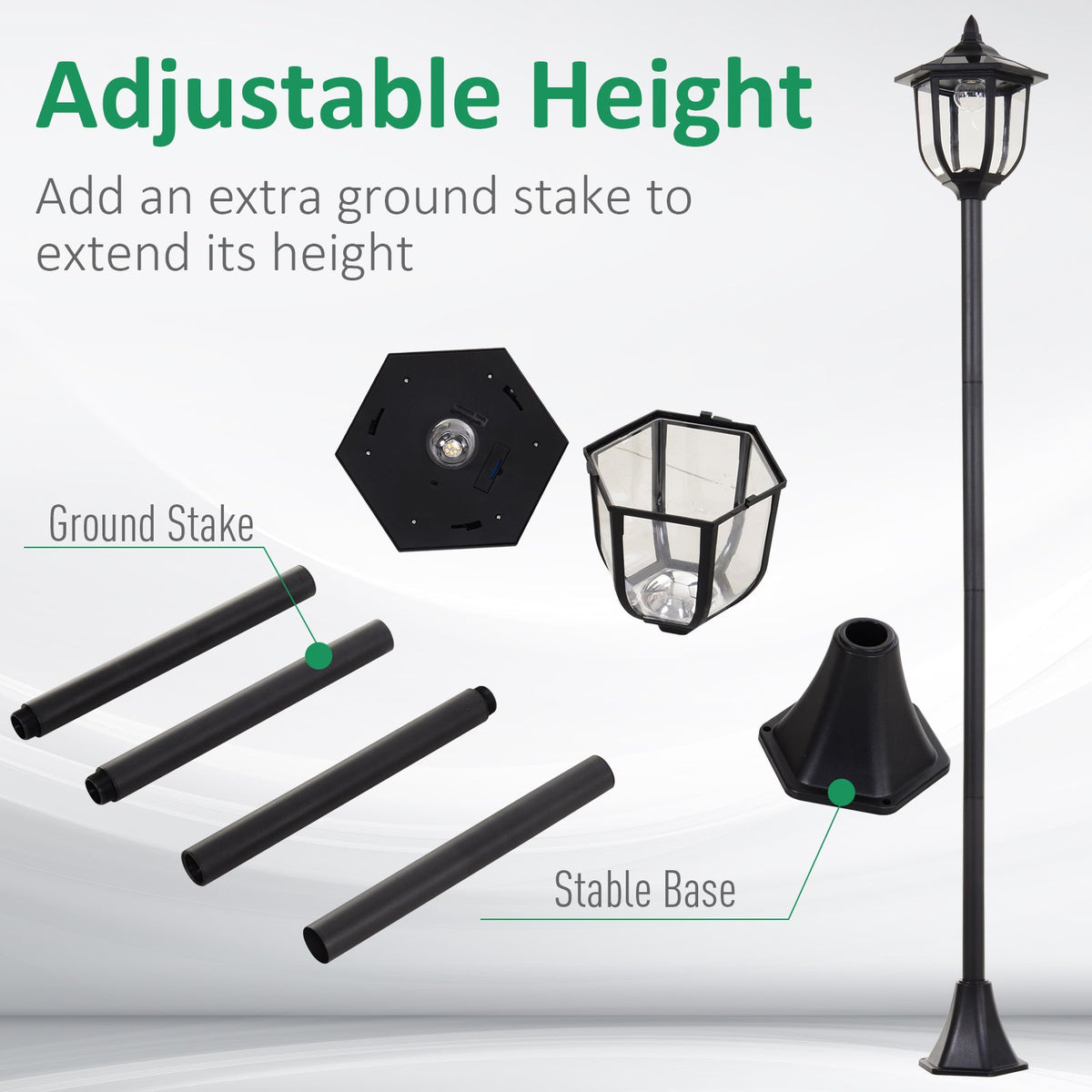 The solar post lamp parts laid out, showing sections of the pole, base and ground stake