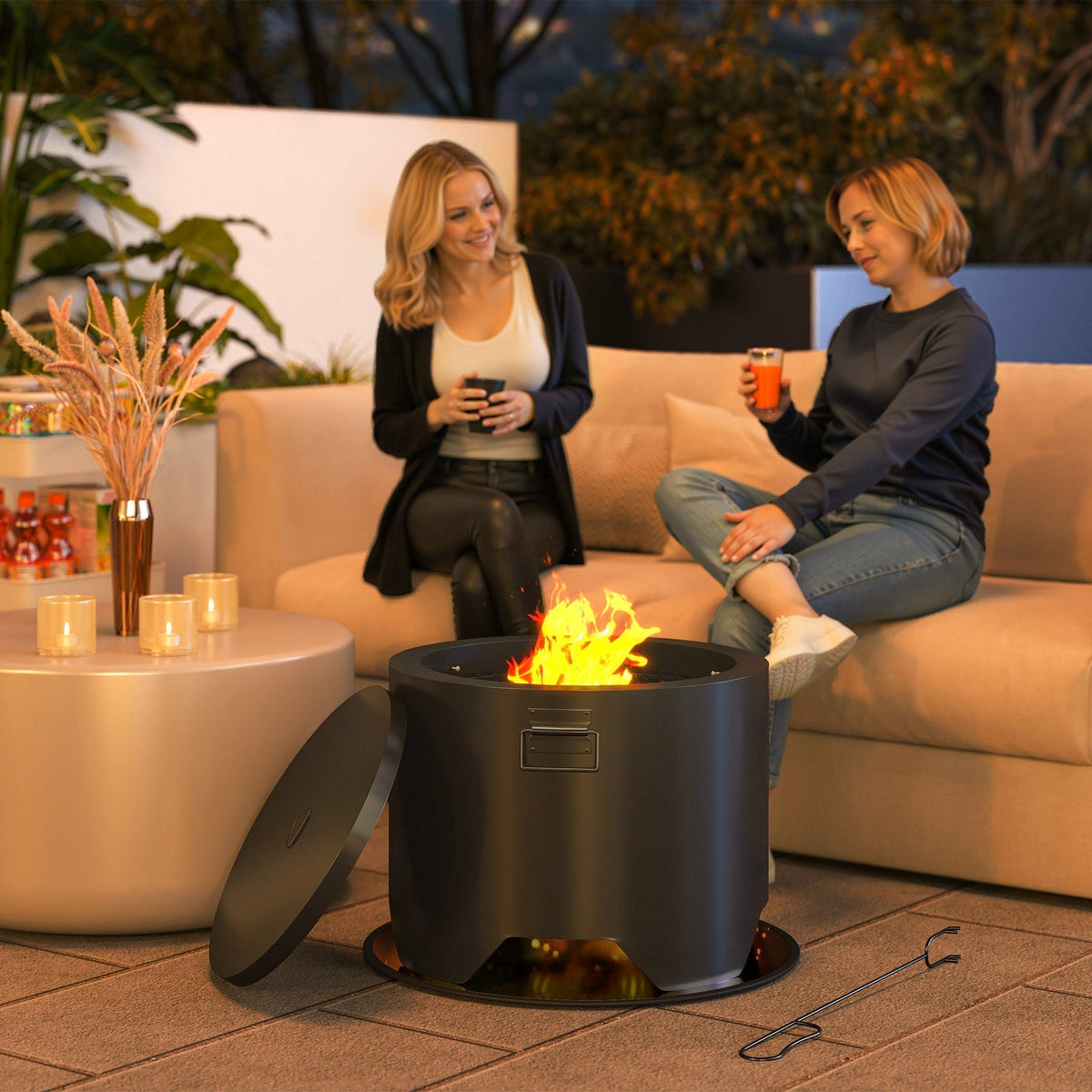 the round fire pit in use with a bright flame while two women sit on a sofa nearby