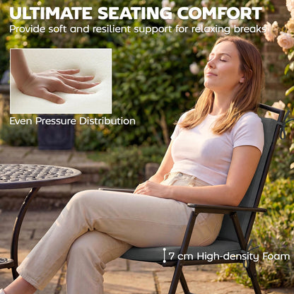 The garden seat pads in use by a woman sitting comfortably on a patio chair outdoors