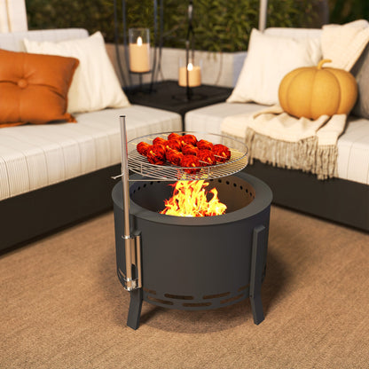 The fire pit on a patio with food cooking on the grill grate and autumn decor nearby