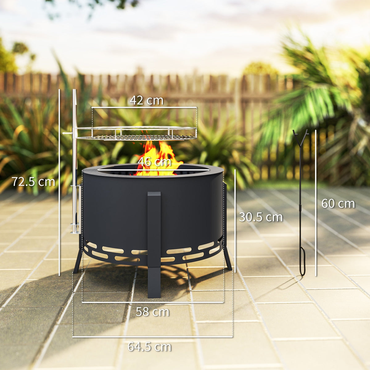 The fire pit showing various dimensions and a poker tool on a paved outdoor surface