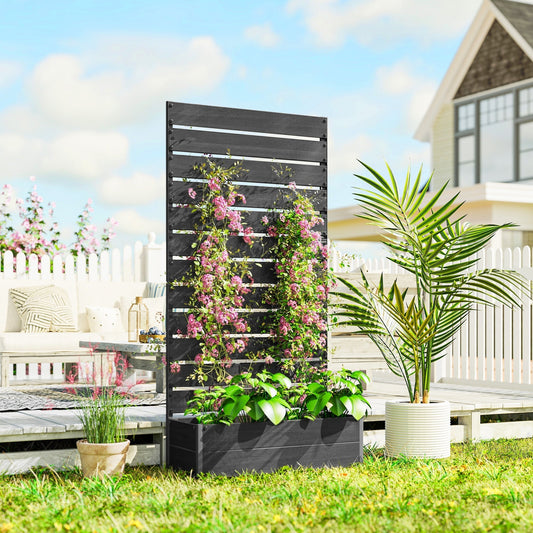 The black garden planter filled with pink climbing flowers on a sunny patio garden setting