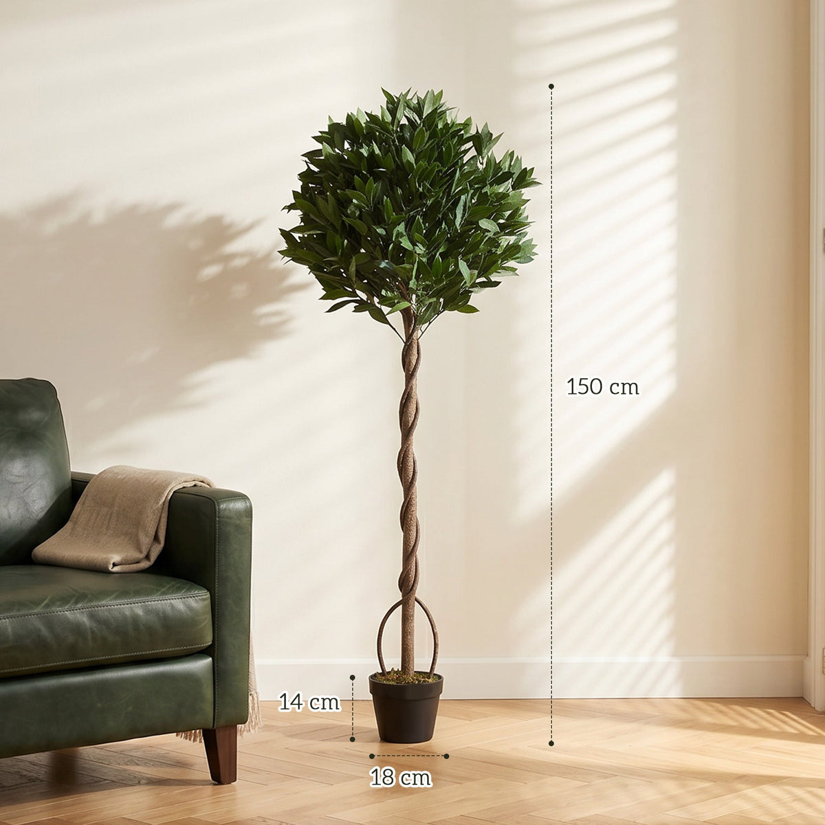 The artificial bay laurel tree standing next to a sofa, with dimensions shown