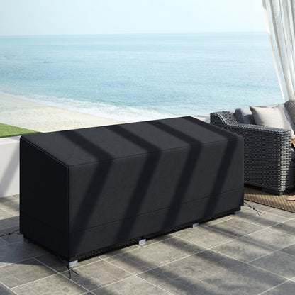 The waterproof patio furniture cover on a rattan sofa set by the sea