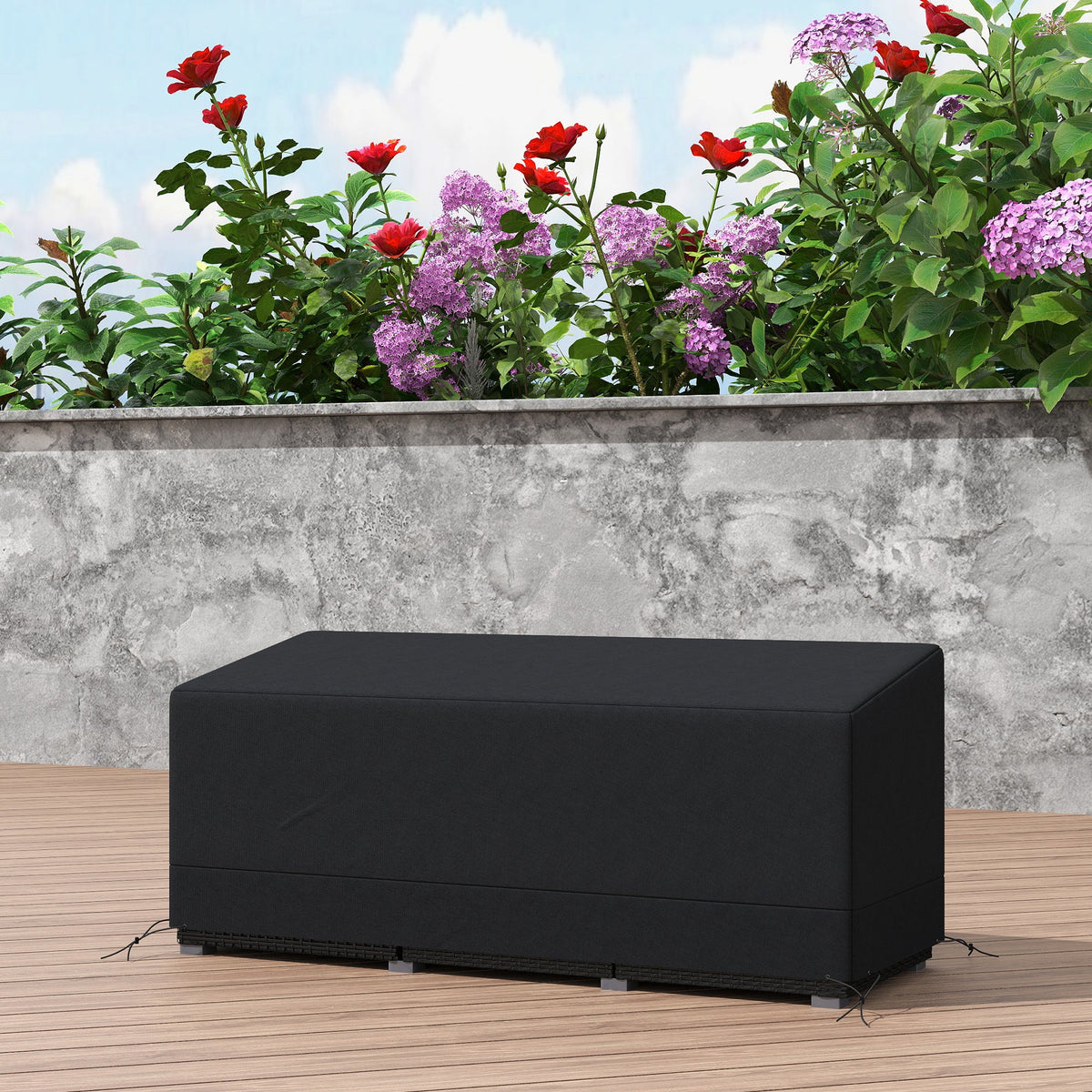 The rectangular garden furniture cover on a wooden deck with flowers