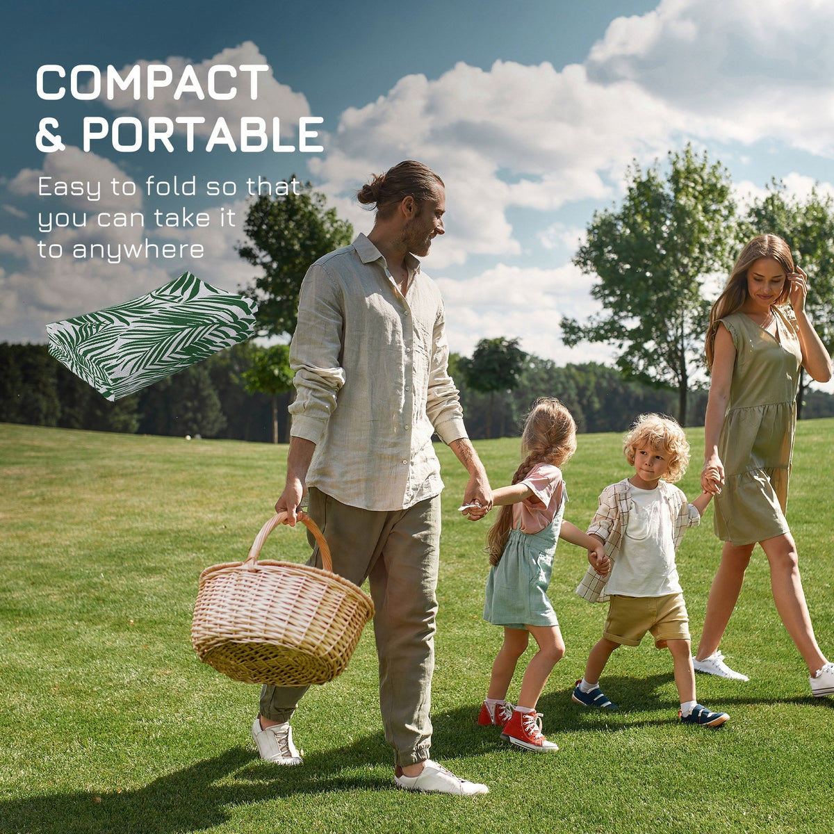 A family carrying the folded outdoor rug for a picnic