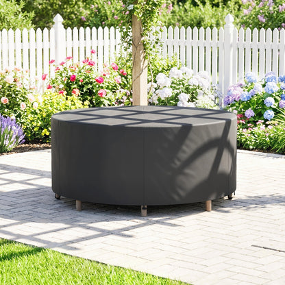 the waterproof garden table cover protecting a round table in a garden setting