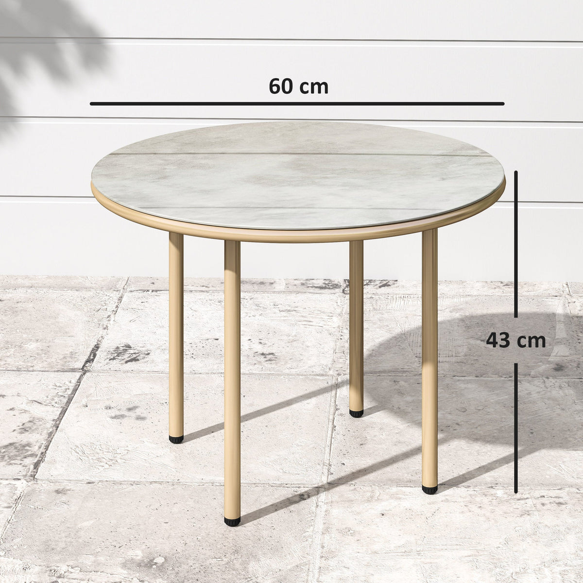 The round garden table with black lines indicating its height and width on a patio