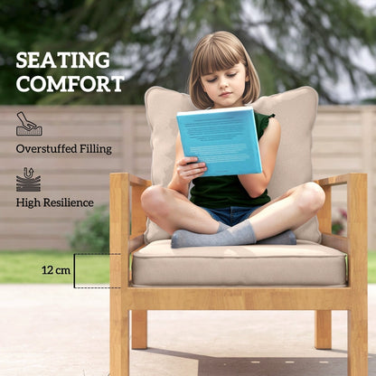 A girl reading a book while sitting on a wooden chair with beige garden cushions