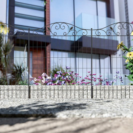 The garden fence standing in front of a modern house with flowers in the background