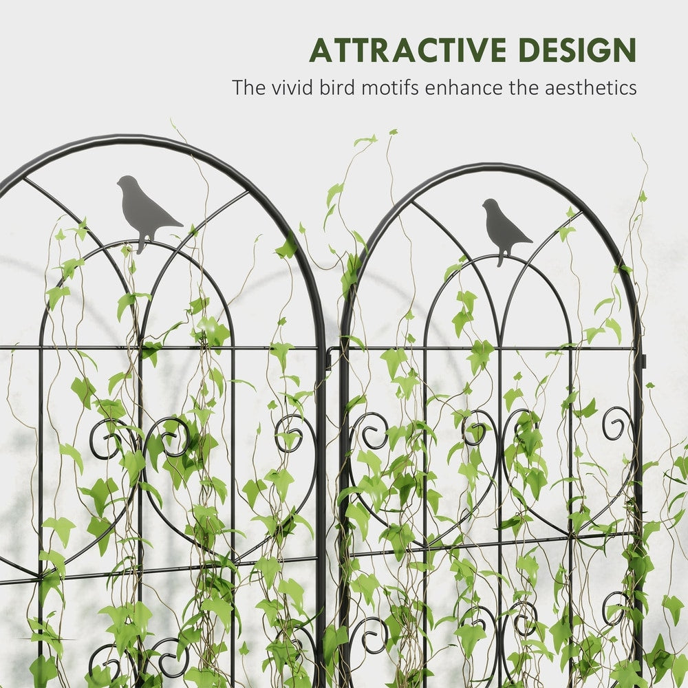 Close-up of the metal garden fence panels, showing the bird motif and climbing plants