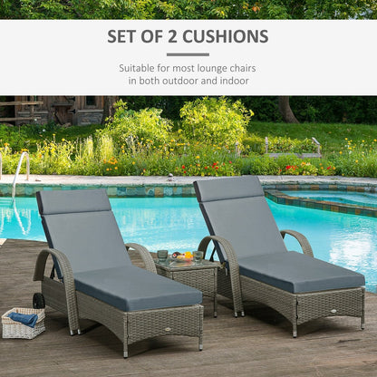 Two dark grey sun lounger cushions shown on rattan furniture next to a pool