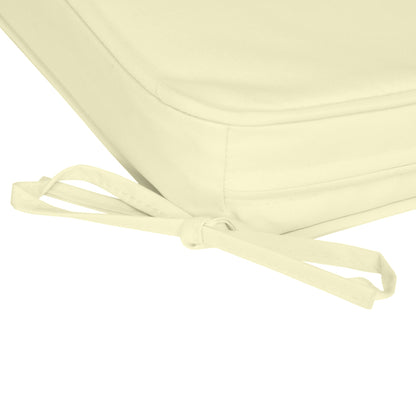 The chair cushion showing a close-up of the fabric tie used to secure it to a seat