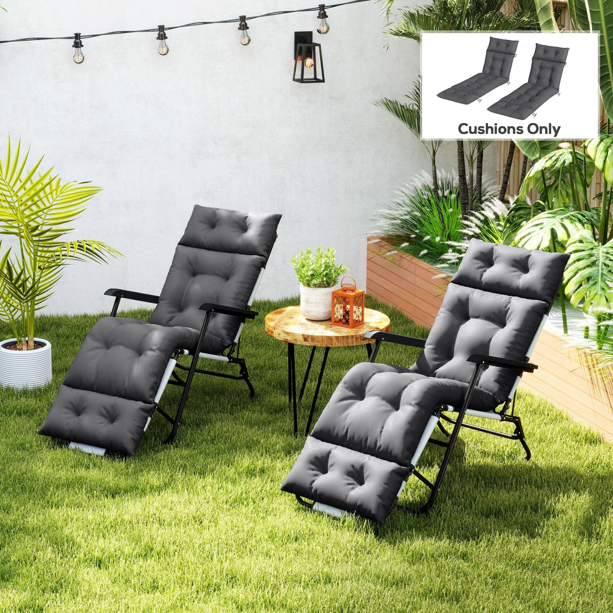 Two dark grey sun lounger cushions on garden loungers in a garden setting