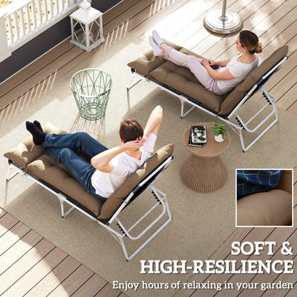 The sun lounger cushions being used by two people relaxing on a patio