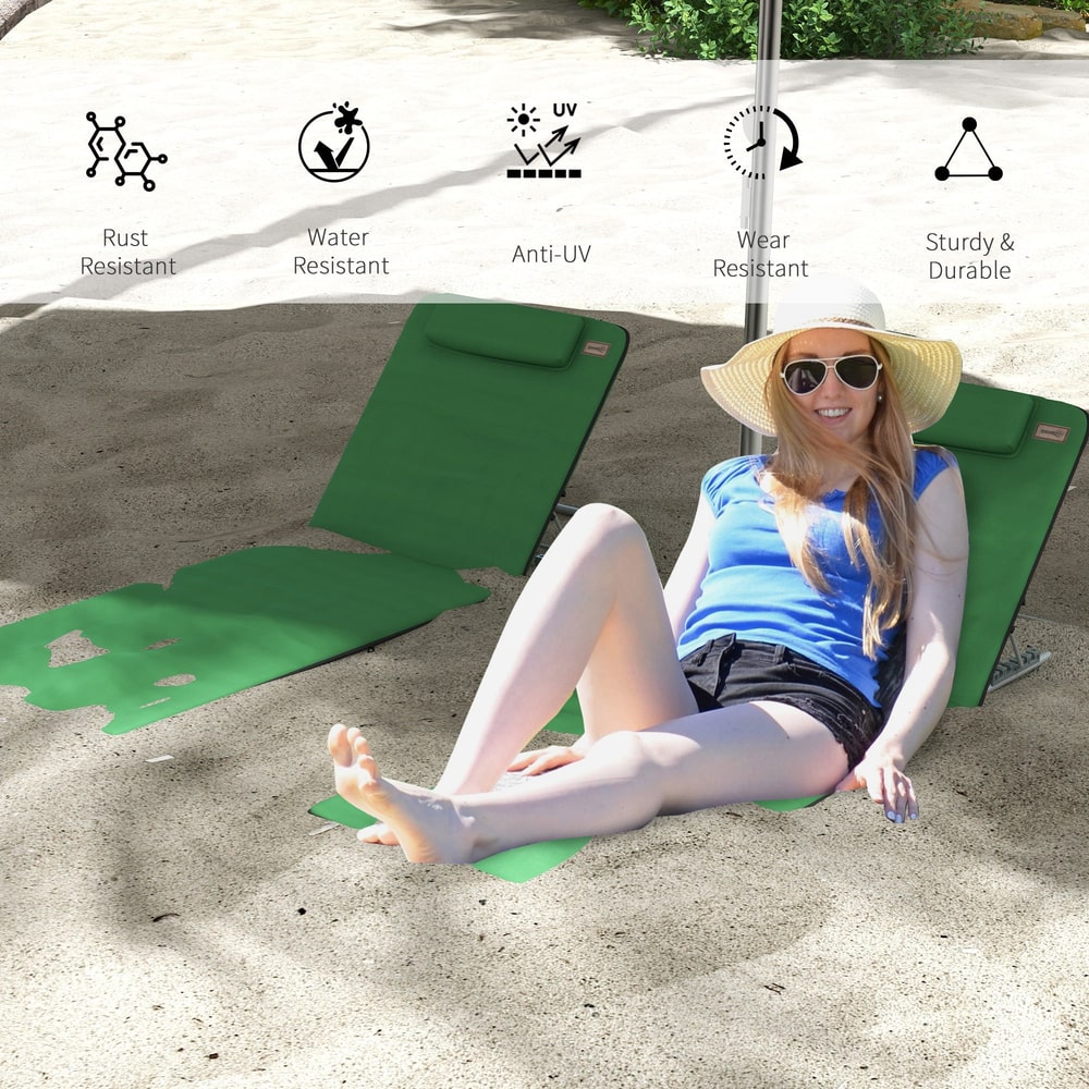 Woman sitting on a green metal frame beach chair on the sand, with icons indicating features