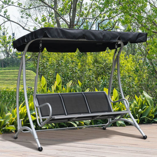 Black three-seater garden swing chair with canopy in a garden setting