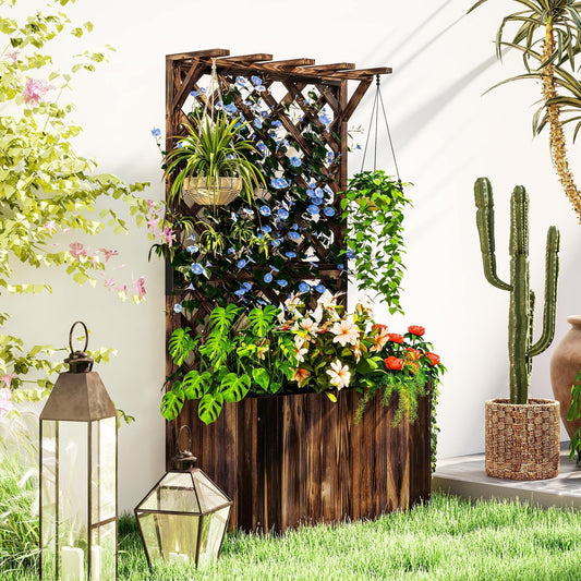 The wooden planter placed on a lawn next to lanterns and a cactus in a garden setting