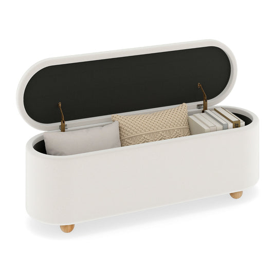 Oval Storage Bench with flip top lid open showing storage space inside with books and cushions