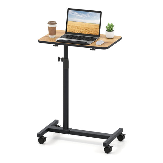 Overbed Table with a laptop and coffee cup on its surface