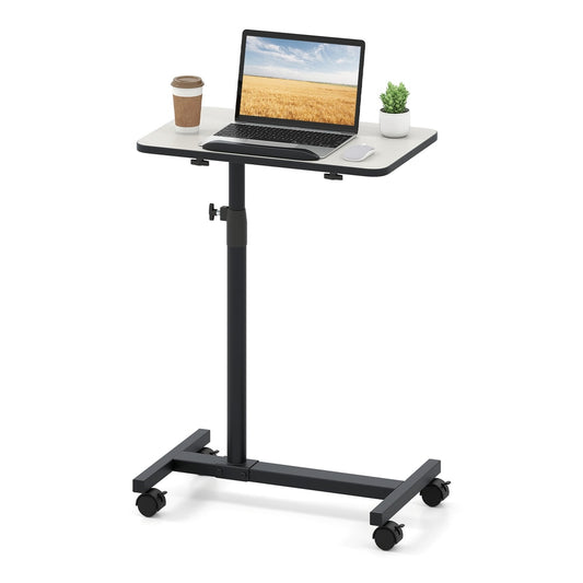 Overbed Table with a laptop and coffee cup on top, on wheels