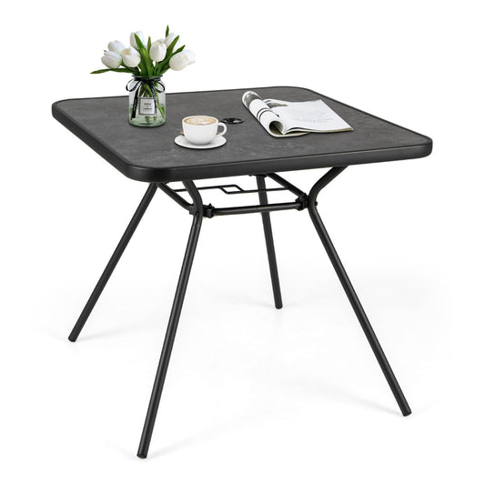 Patio Square Outdoor Dining Table with a vase of flowers and a coffee cup on top