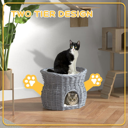 The two tier wicker cat house with two cats enjoying the levels