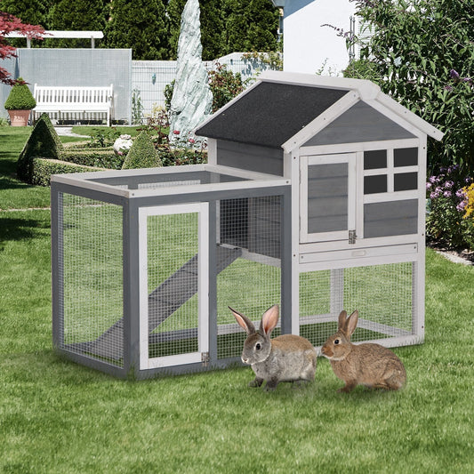 PawHut 2 Tier Wooden Guinea Pigs Hutches with two rabbits on a green lawn in a garden setting