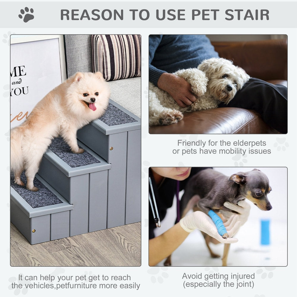 Two dogs using the grey three-step pet stair, one going up and one resting on a sofa