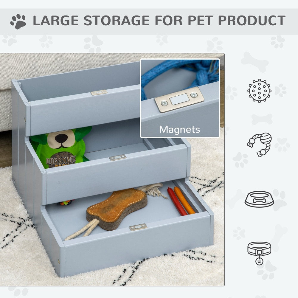 Open storage drawers on the grey three-step pet stair, showing pet toys inside