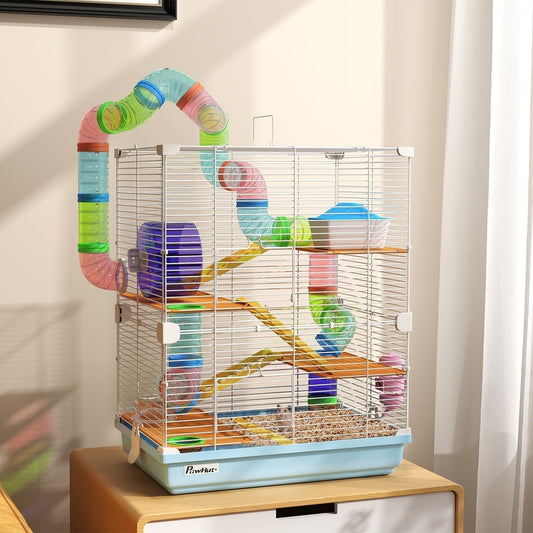 The hamster hutch is shown on a table with a white background