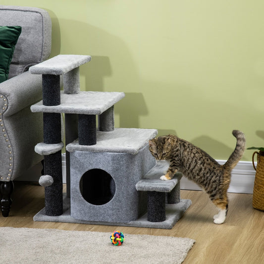 A cat climbing the grey pet steps with house and toy ball in a living room