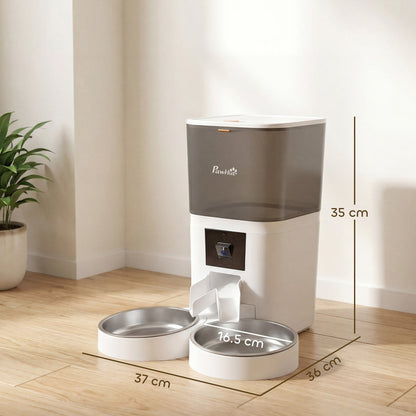 the automatic pet feeder showing height and width measurements on a wooden floor