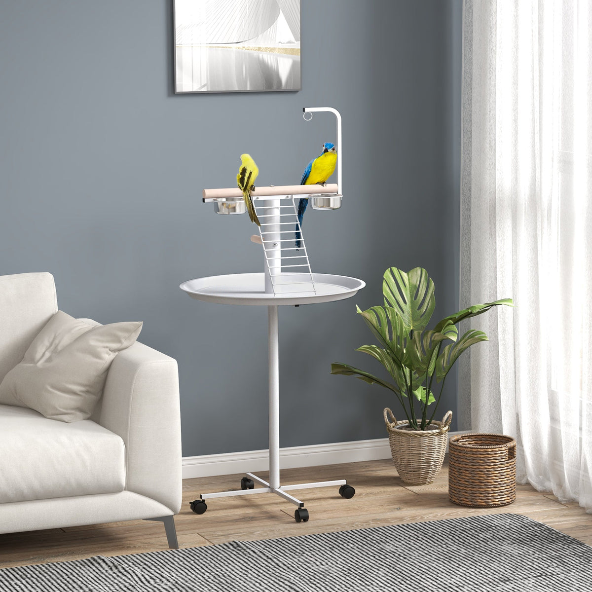 The bird stand with four wheels in a living room with two budgies perched on it