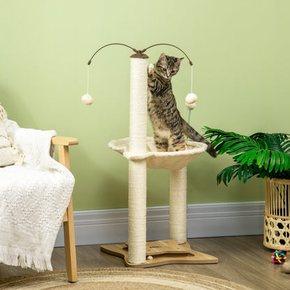 A tabby kitten plays on the cat tree in a living room setting