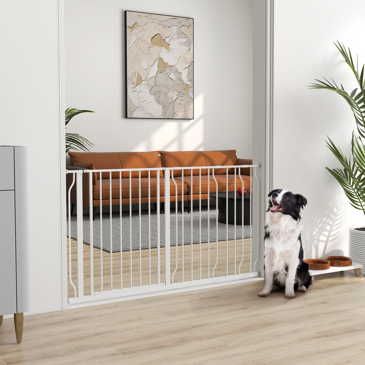 The white dog gate installed in a doorway with a dog sitting on the floor nearby