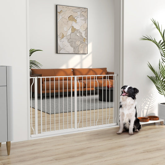 The white dog gate installed in a doorway with a dog sitting on the floor nearby