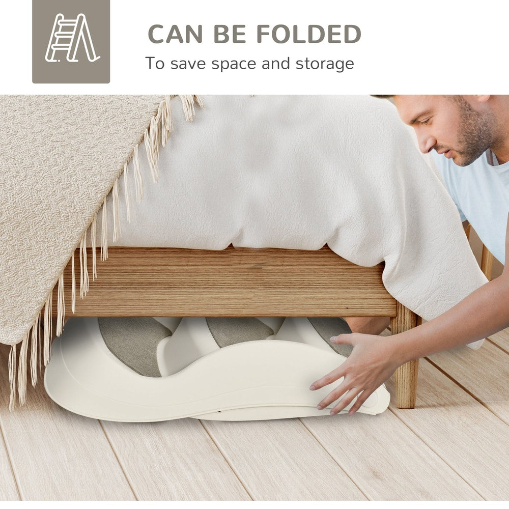 A man folds the cream three-step pet stairs for storage