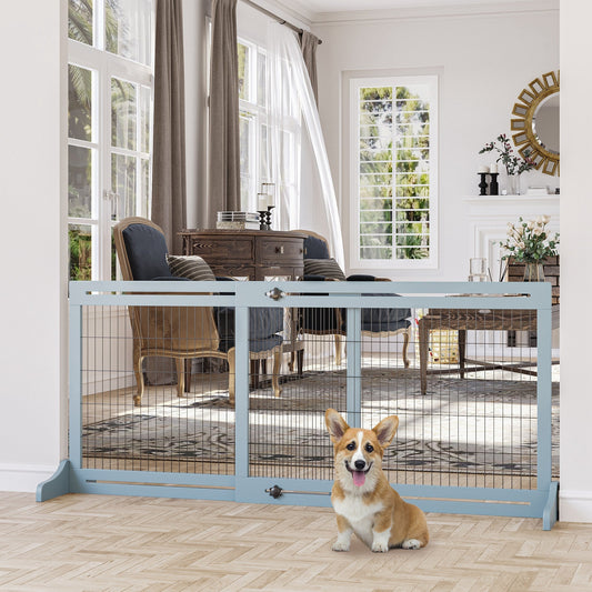 The dog gate placed in a living room with a small dog sitting in front of it