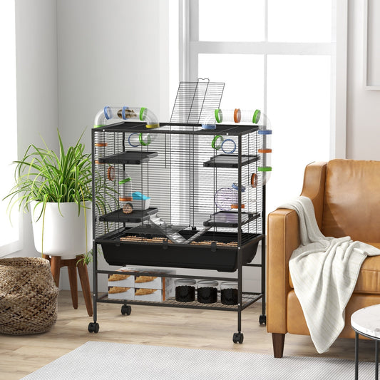 The hamster hutch is shown set up in a living room next to a sofa and a plant