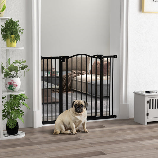 The dog gate installed in a doorway with a pug sitting in front of it in a living room