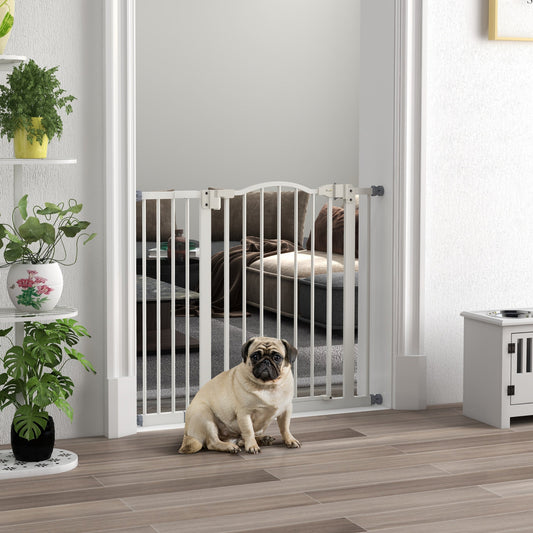 The dog gate installed in a doorway with a pug sitting on the floor in front of it