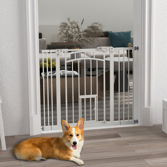 The white dog gate is installed in a doorway with a corgi lying down in front of it