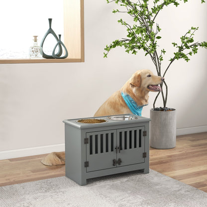 The grey pet feeding station with two bowls on top, shown in a room with a large dog wearing a blue bandana