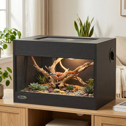 Reptile vivarium with a snake inside on a wooden table