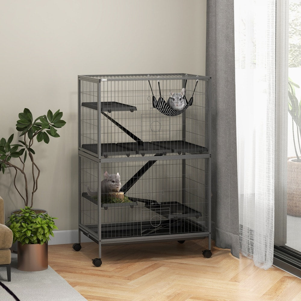 The hamster hutch and cage is shown in a room with plants and a window