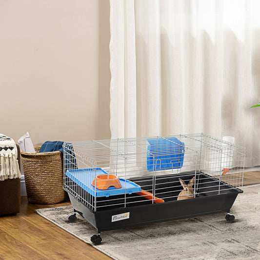 The hamster hutch is shown in a room with a rabbit inside, set on wheels